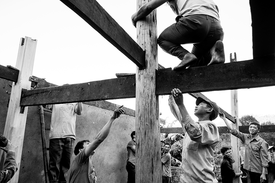 Villagers assist in constructing a new building. Ta Giang Phing, Sa Pa, Vietnam