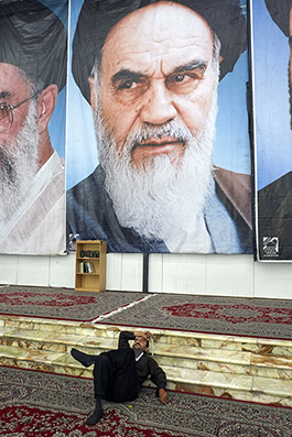 A man prays in the mausoleum built for Ayatolah Khomeini - Iran